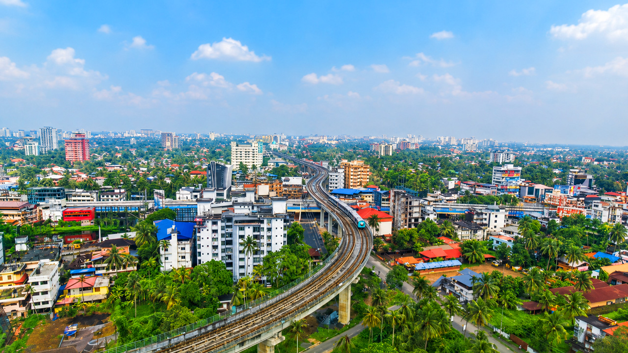 Modern metro lines running through Ernakulam’s green cityscape