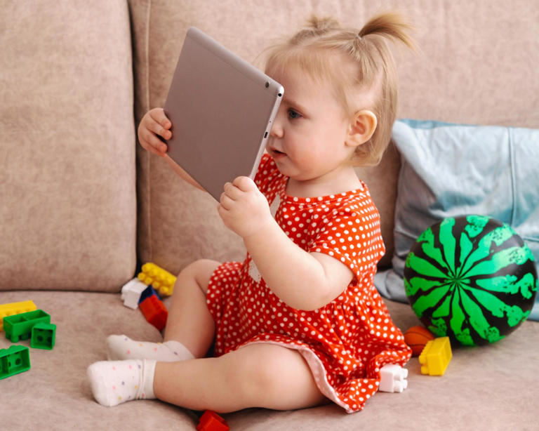Screen time can reduce babies’ opportunities for physical play and bonding with caregivers and limit language development, researchers said. Photograph: dvulikaia/Getty Images