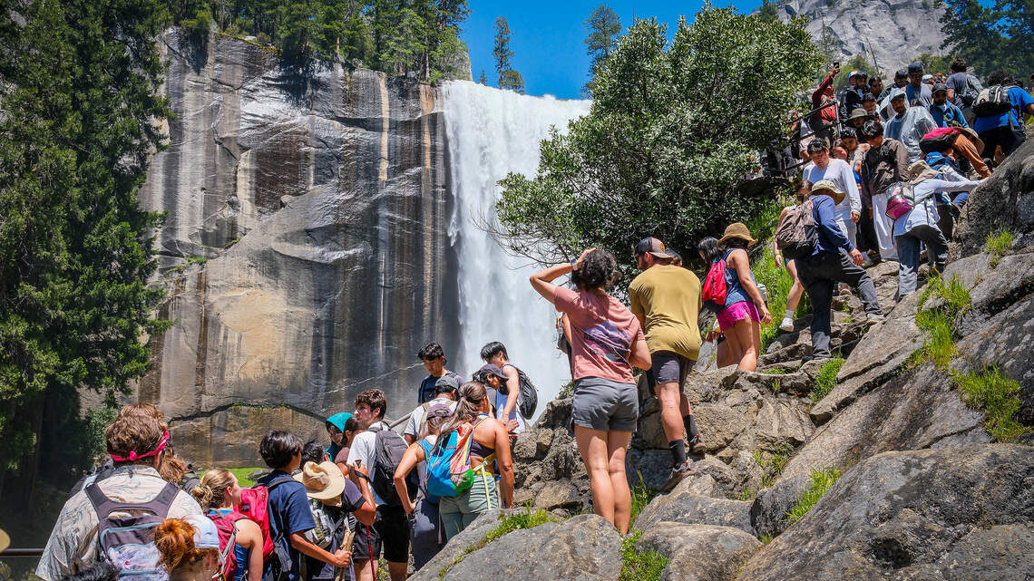 Hikers crowd together to get a view of Vernal Fall on Yosemite National Park’s Mist Trail on a busy Memorial Day weekend, Saturday, May 23, 2026.