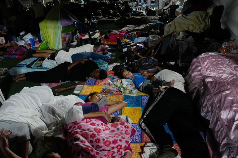 People whose homes were destroyed sleep at a sports complex serving as a shelter three days after earthquakes struck La Guaira, Venezuela, Saturday, 27 June, 2026 (AP)