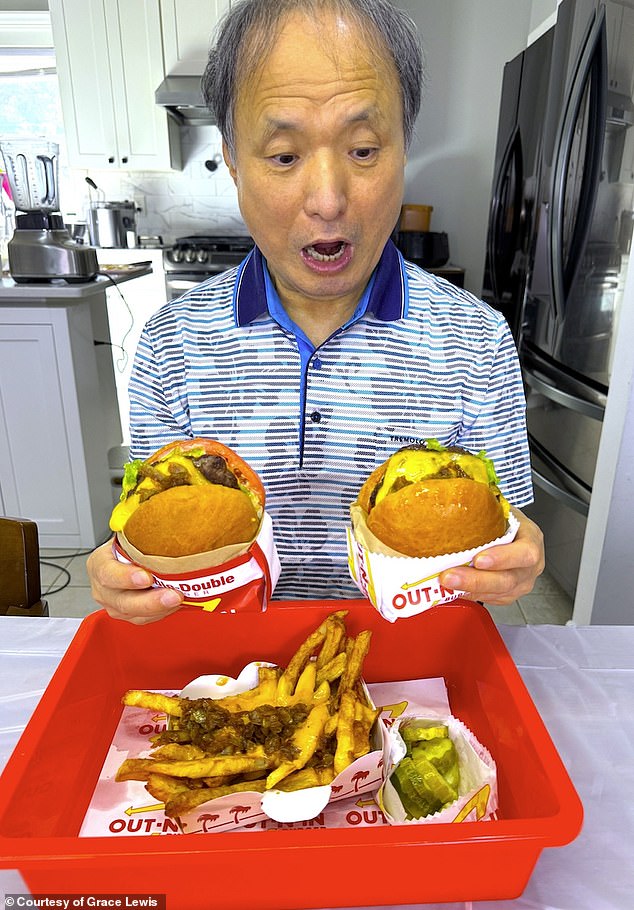 Lewis' father excitedly eyeing his burger. Everyone enjoyed the animal-style sauce, Lewis told the Daily Mail