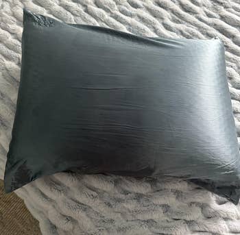 A photo of a reviewer's Blissy silk pillowcase