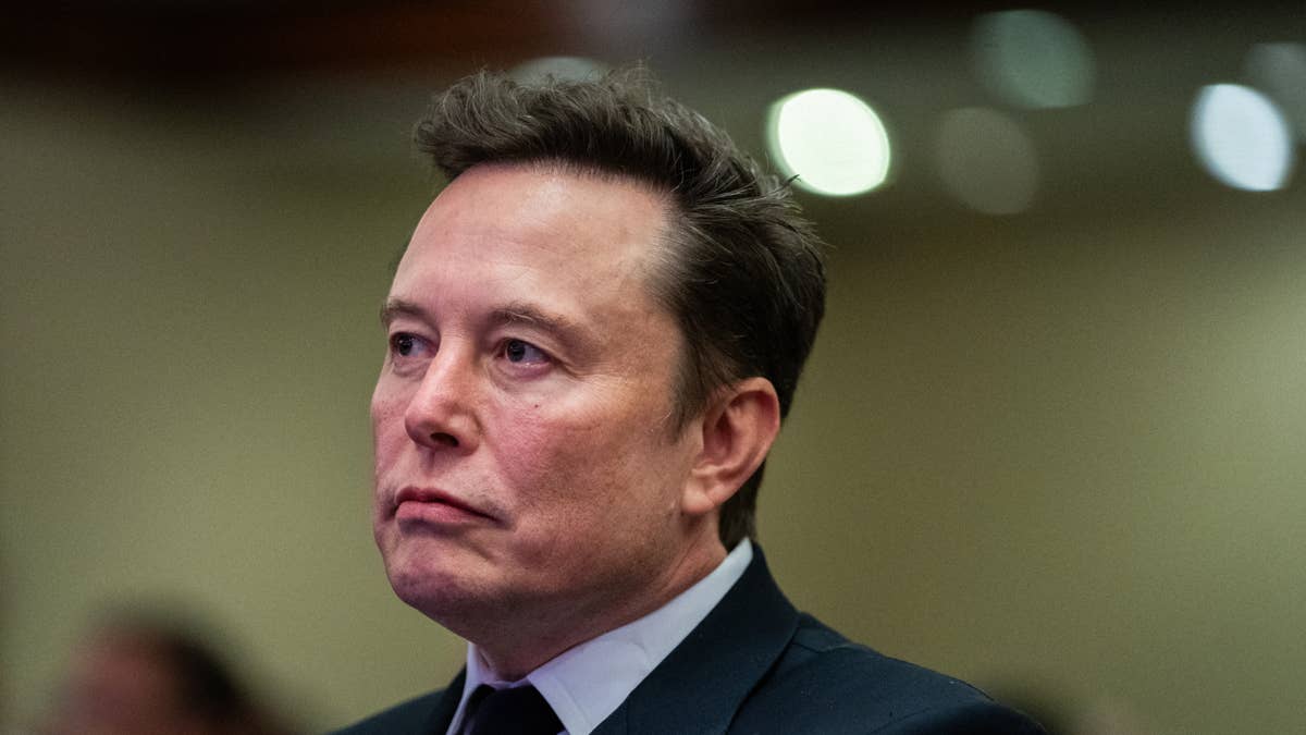 topshot-elon-musk-listens-as-us-president-elect-donald-trump-speaks-during-a-meeting-with-house-republicans-at-the-hyatt-regency-hotel-in-washington-dc-on-november-13-2024-photo-by-allison-robbert-poo