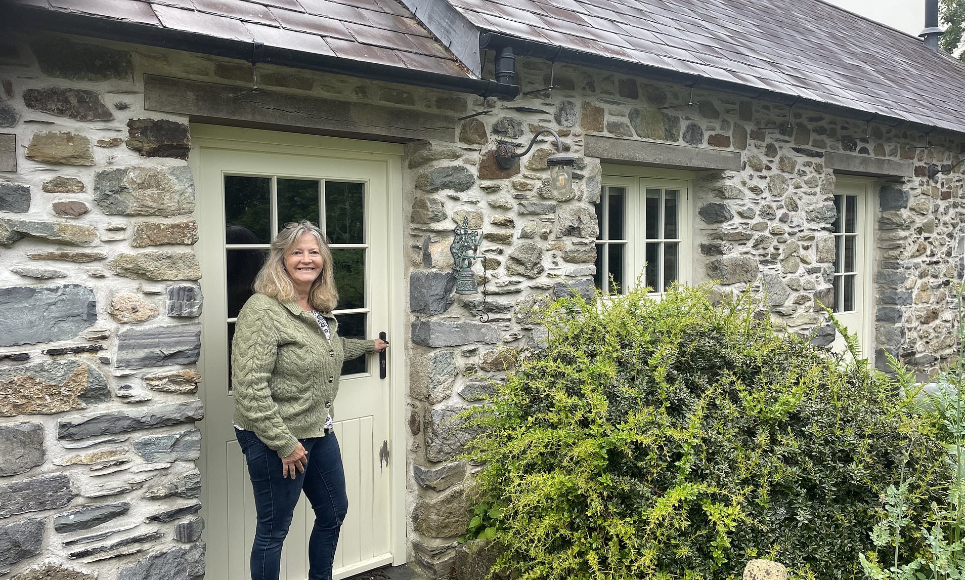 Retiree who restored garden outbuilding as a holiday let is hit with £9,000-a-year council tax bill