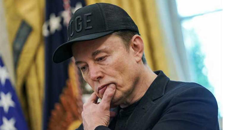 Elon Musk reacts during a press conference with U.S. President Donald Trump (not pictured), at the White House in Washington, D.C., U.S., May 30, 2025. REUTERS/Nathan Howard