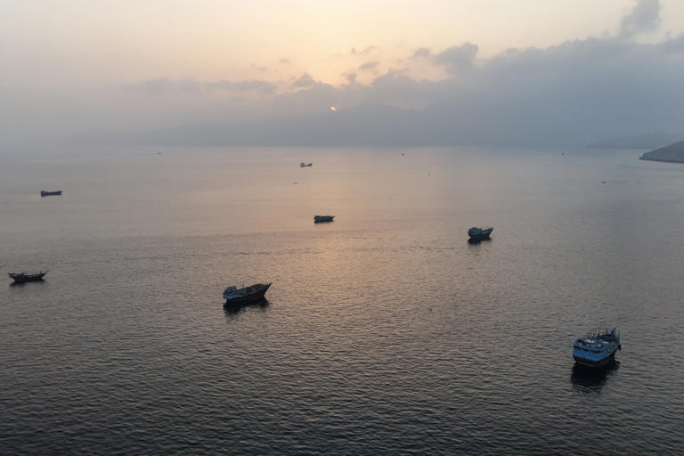 Boats anchored off Oman's coast near the Strait of Hormuz.