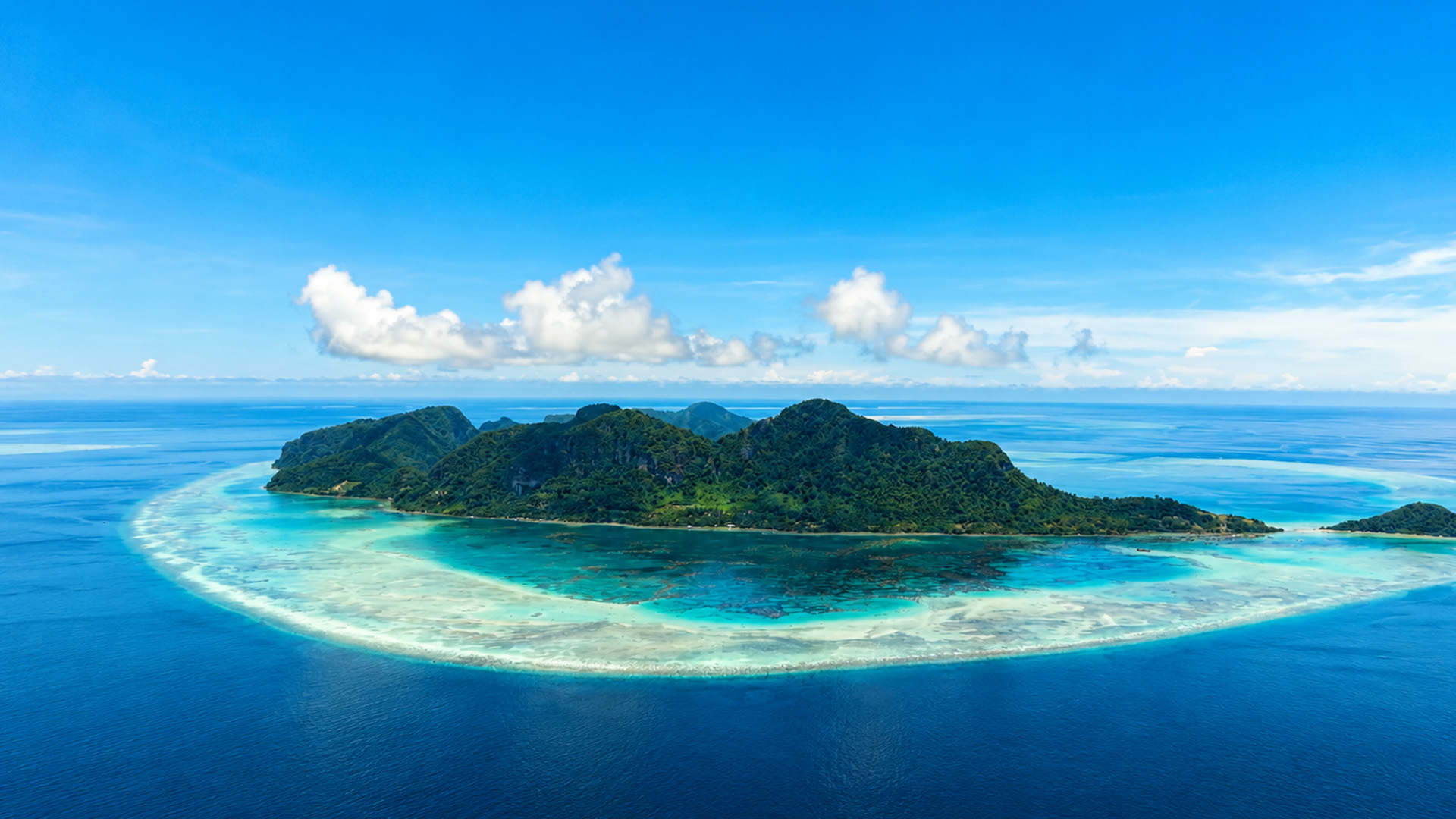 Why does this island have a giant coral ring?