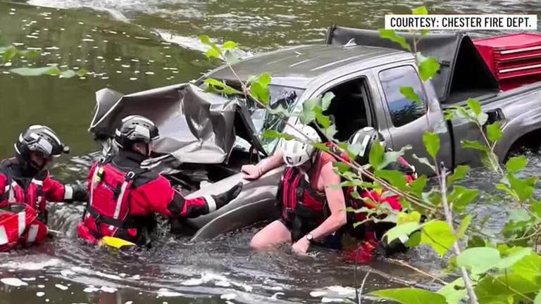Crews rescue driver after pickup crashes into river