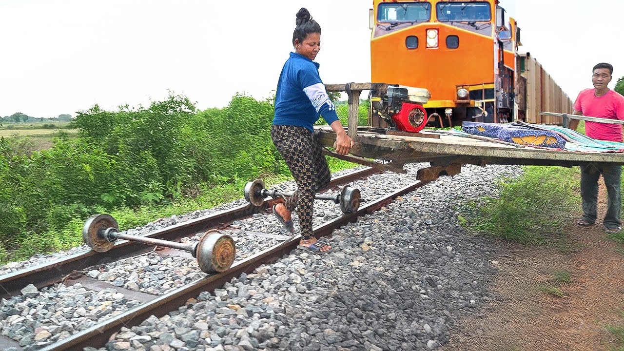 Risky way they ride cheap bamboo carts on train rails