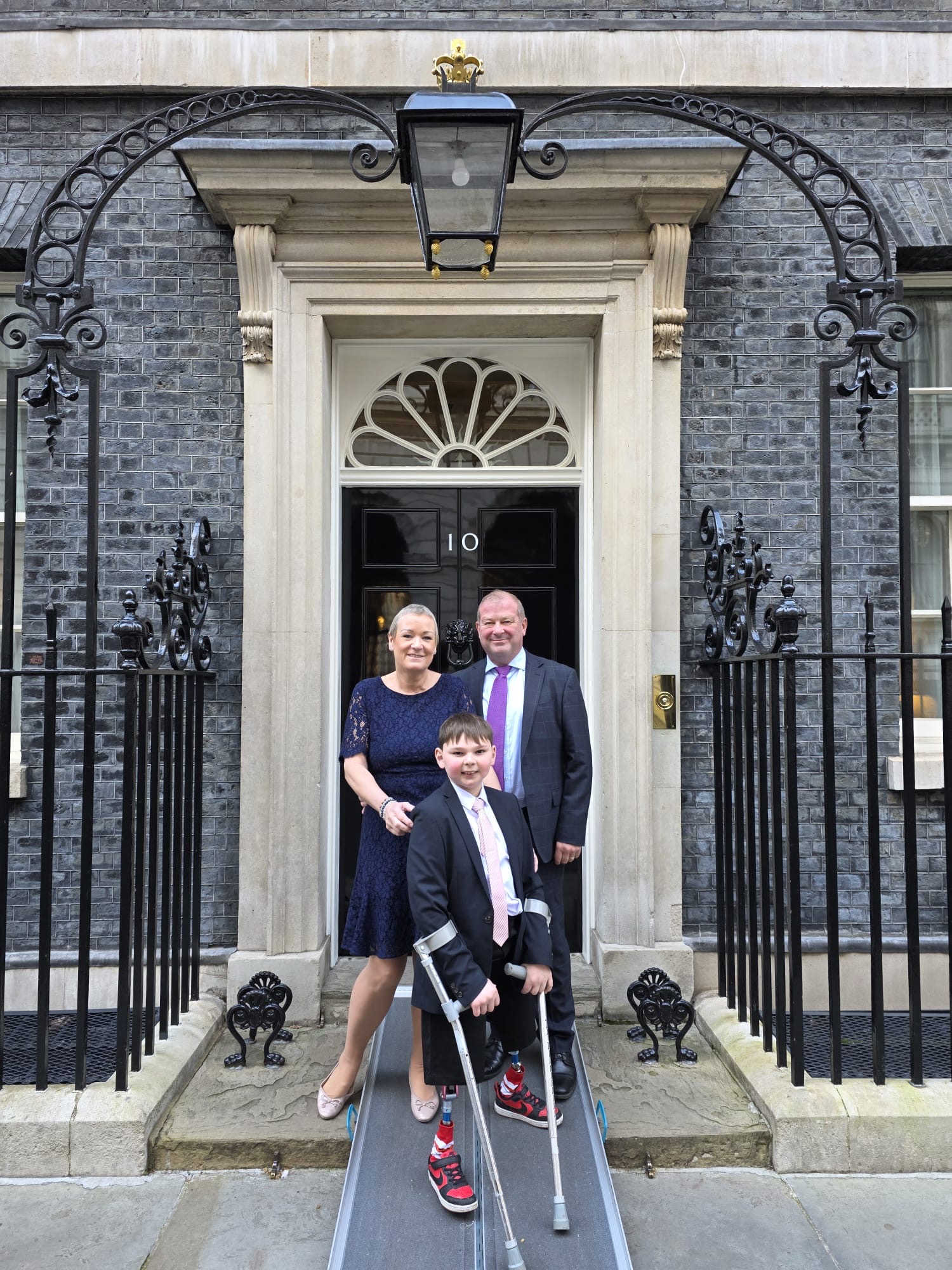 Paula and Mark Hudgell at No.10 with son Tony campaign for a Child Cruelty Register
