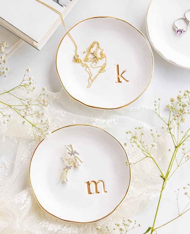 m and k initialed trinket trays holding jewelry