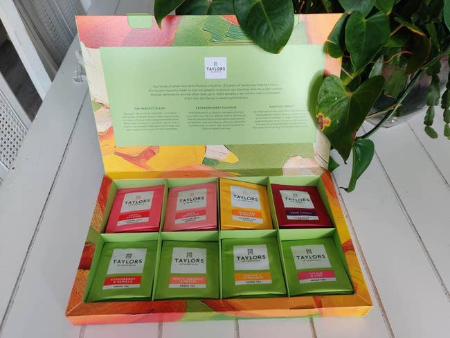 Box of Taylors tea bags, eight flavors displayed. Text describes the brand's history and dedication to quality tea blends