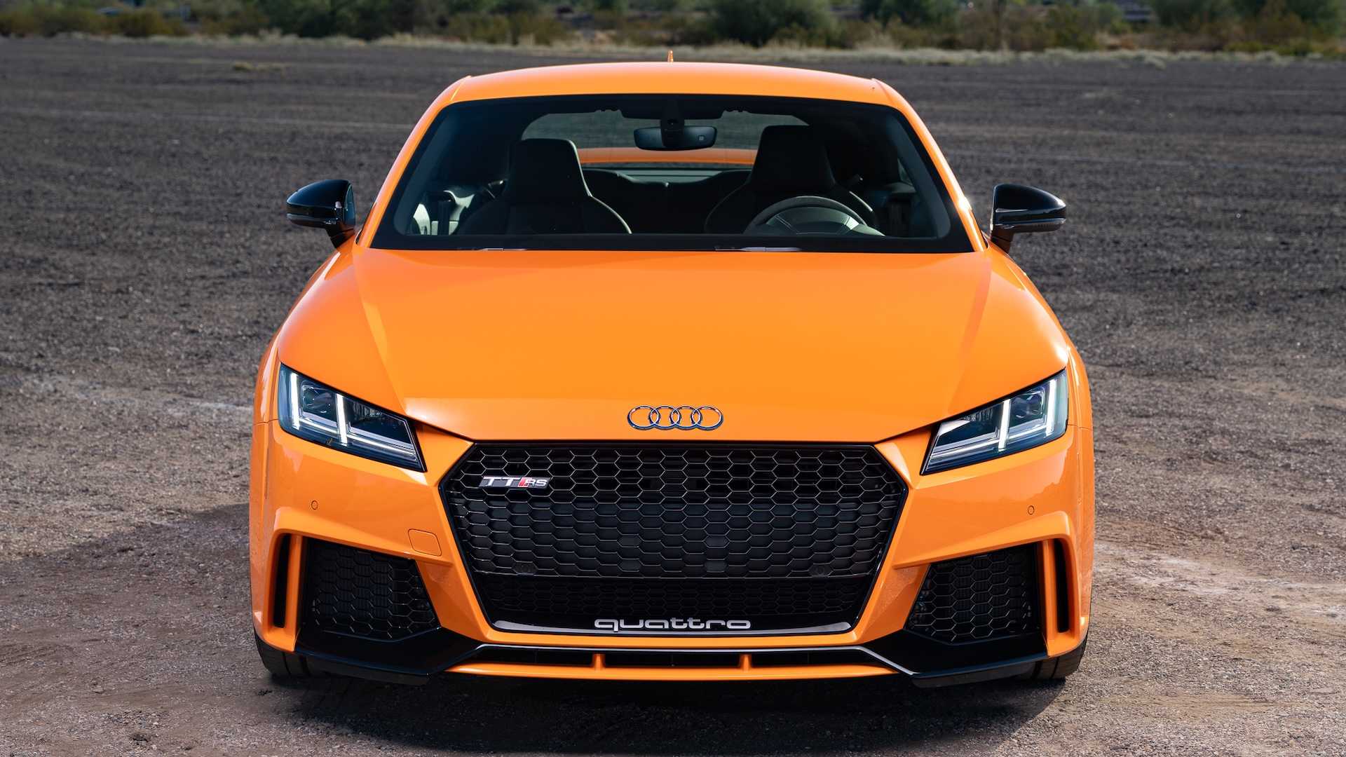 Grille and badge of an orange Audi sports car