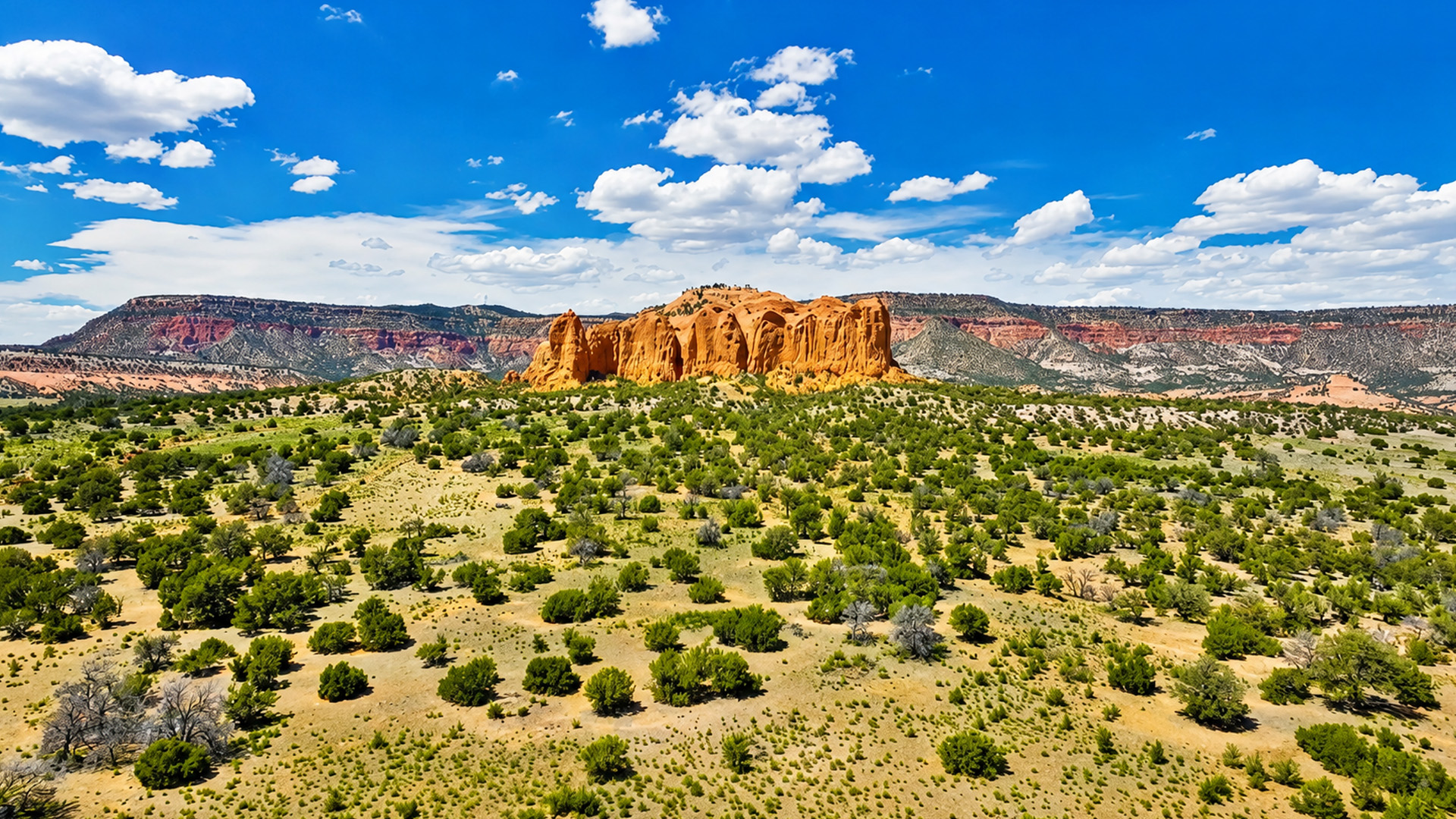 A giant red rock rising alone in the desert
