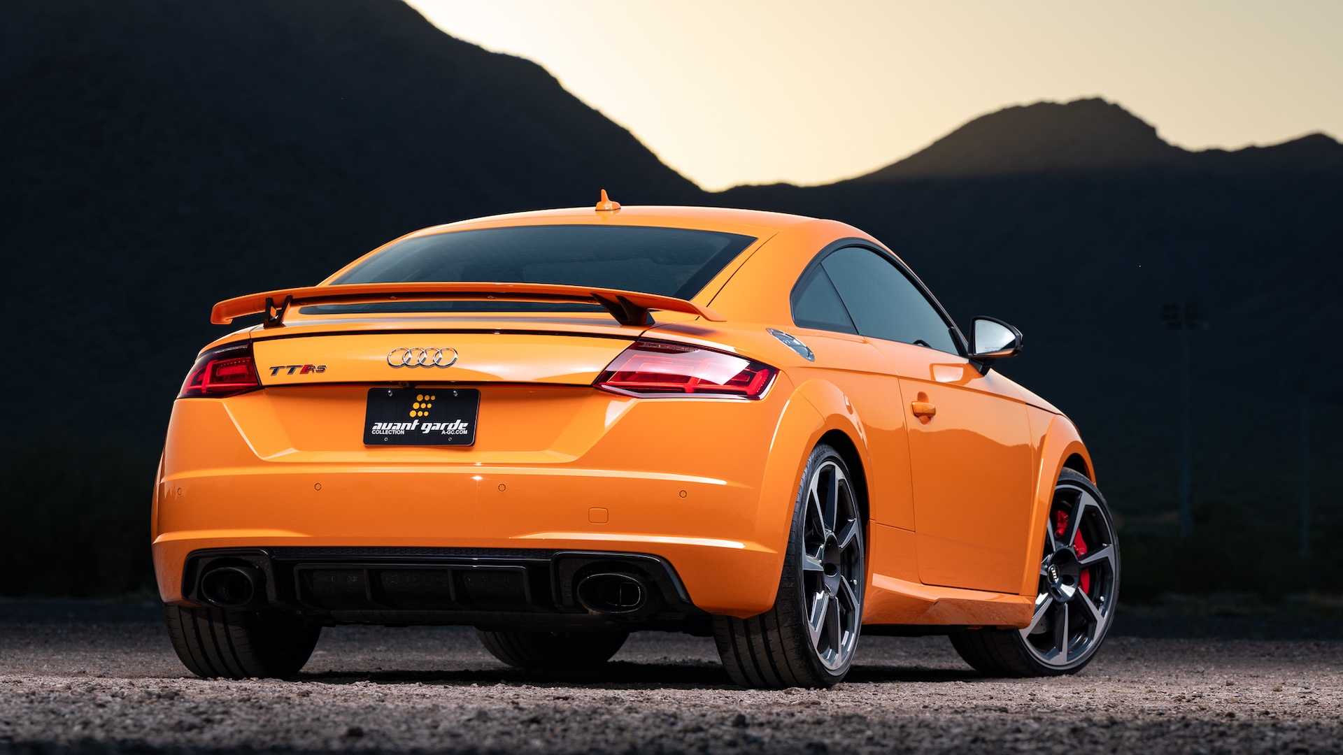 Grille and badge of an orange Audi sports car