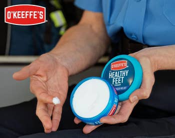 model holding open jar of foot cream