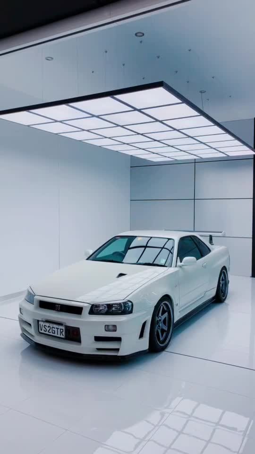R34 GTR V Spec II showroom reveal with clean lighting setup