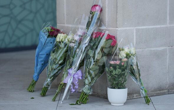 Flowers left outside the scene of the alleged murder
