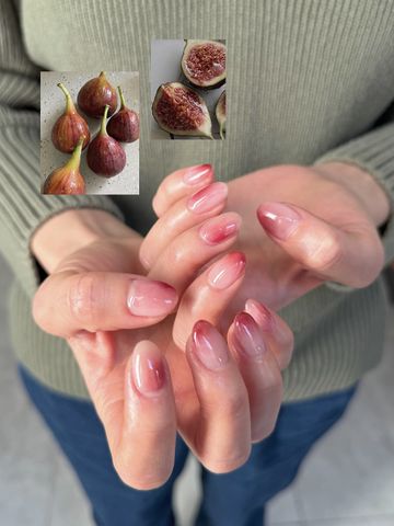 Hands with nail art inspired by figs
