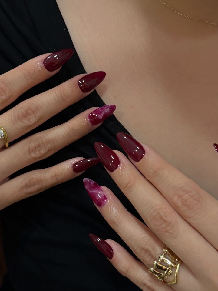 Berry manicure with berry marble accent nails