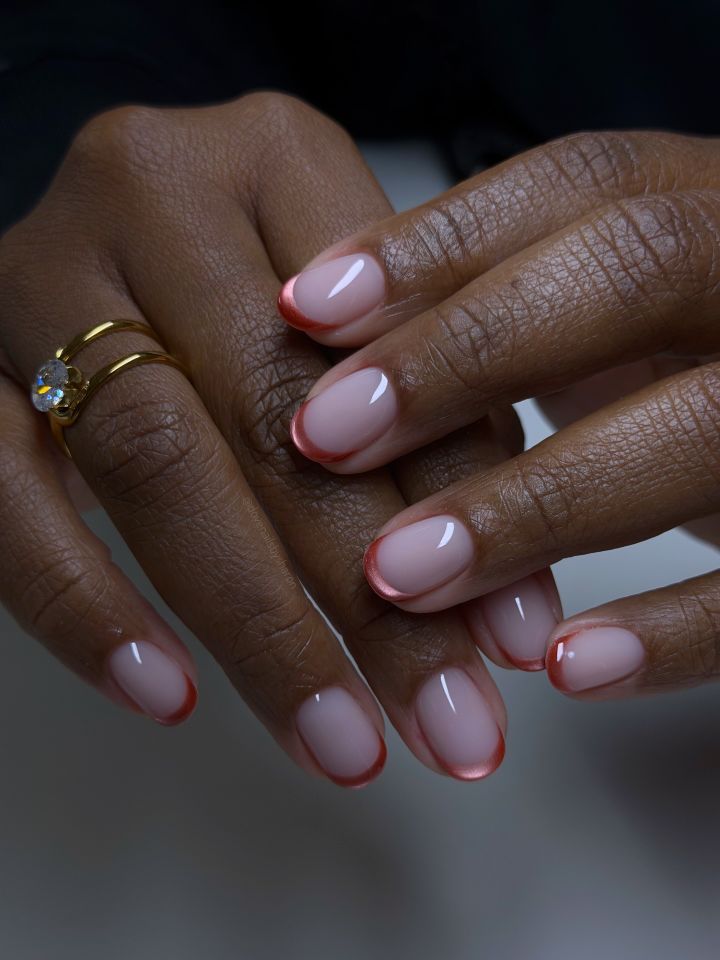 Orange cat-eye French tip nails