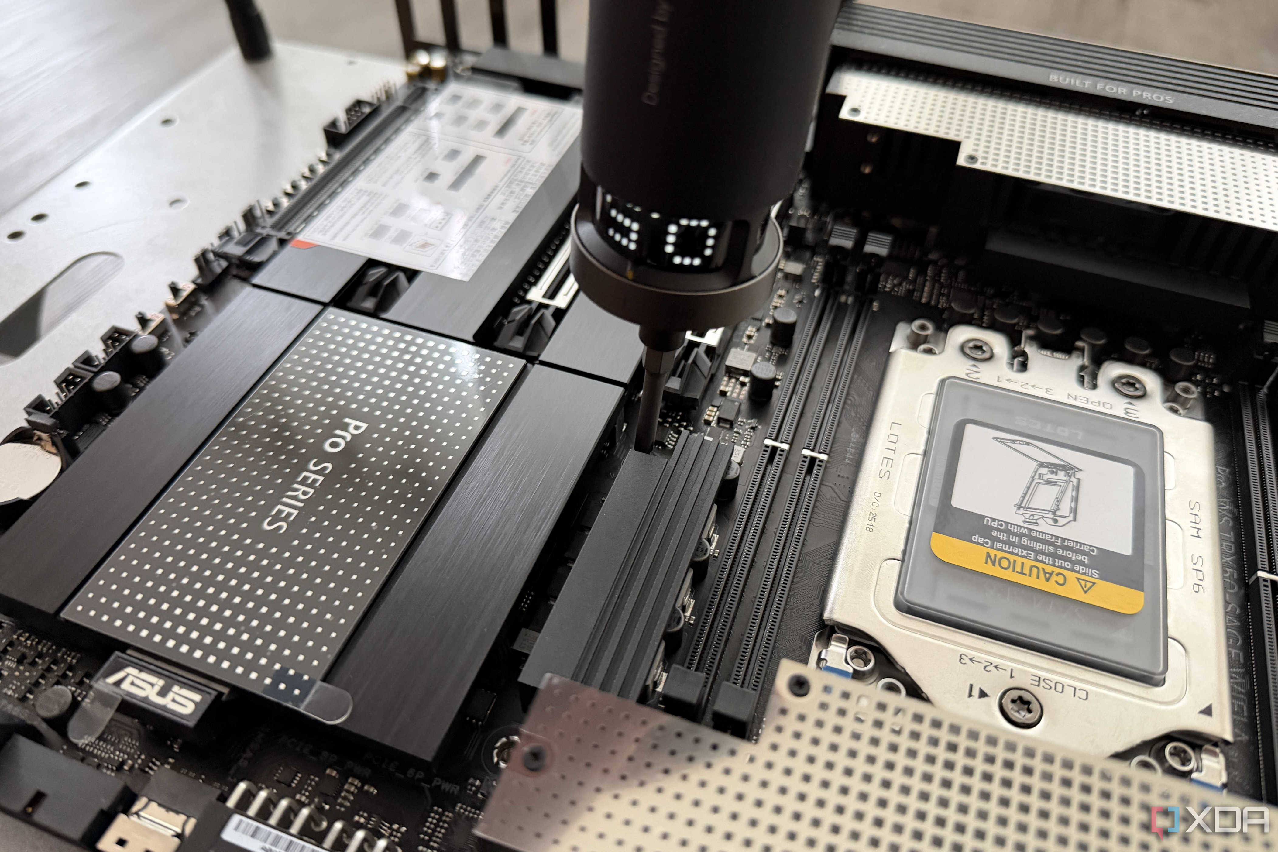 screwing down threadripper motherboard to test bench