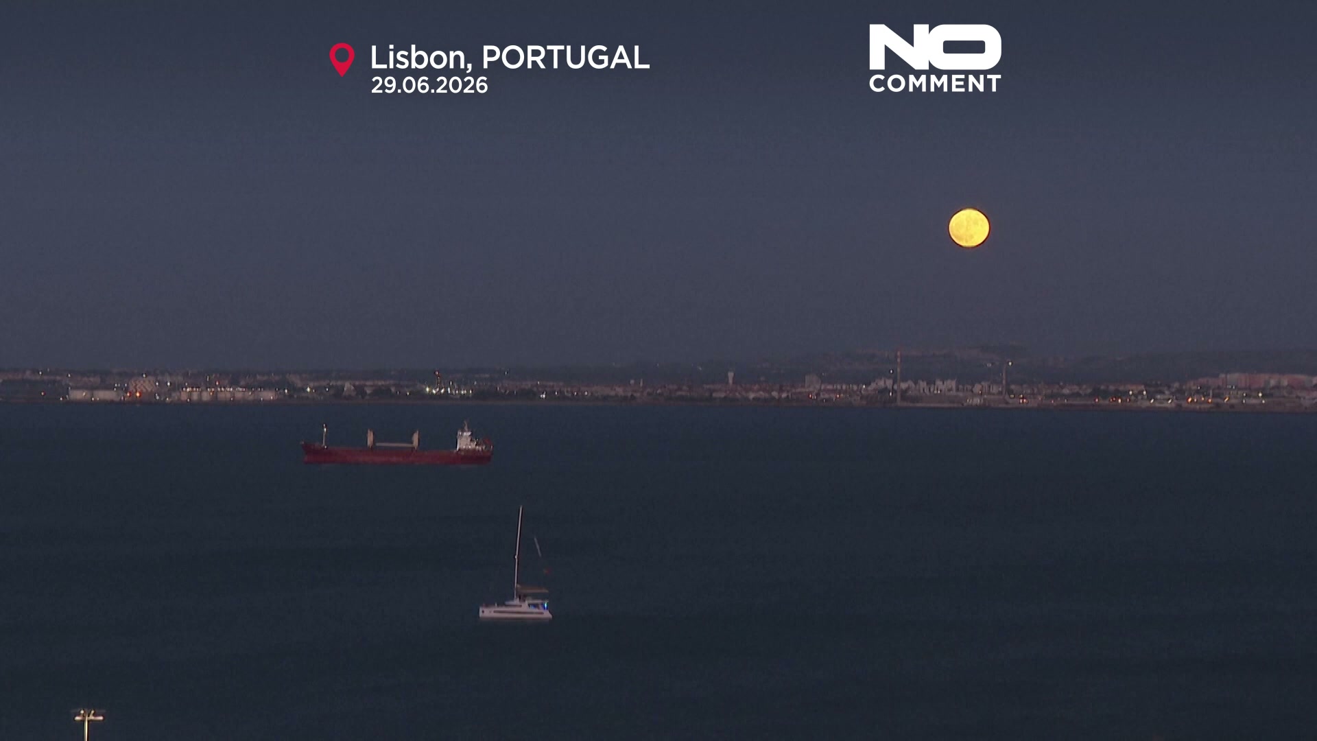 Rare strawberry moon shines over Lisbon