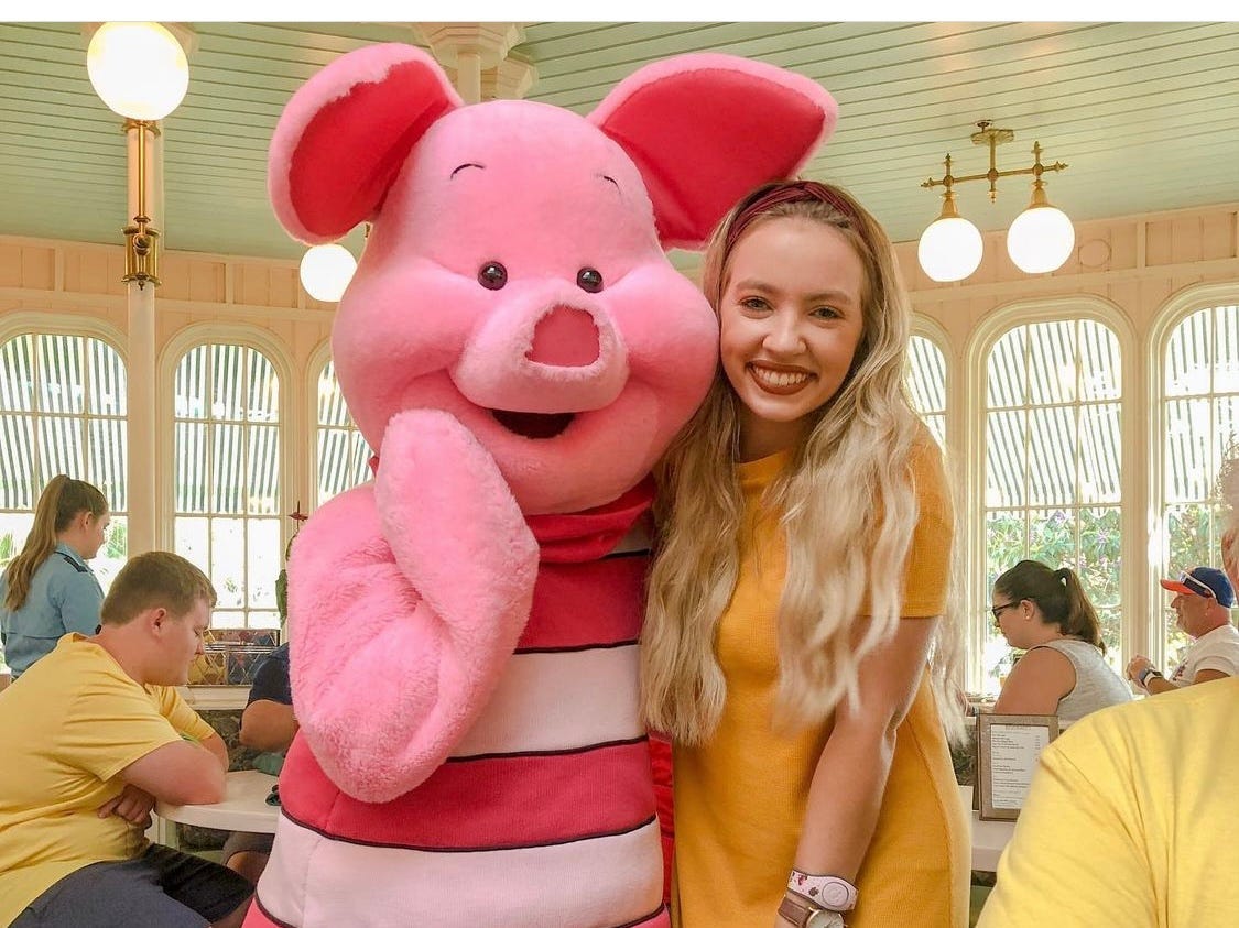 kayleigh posing with piglet at crystal palace