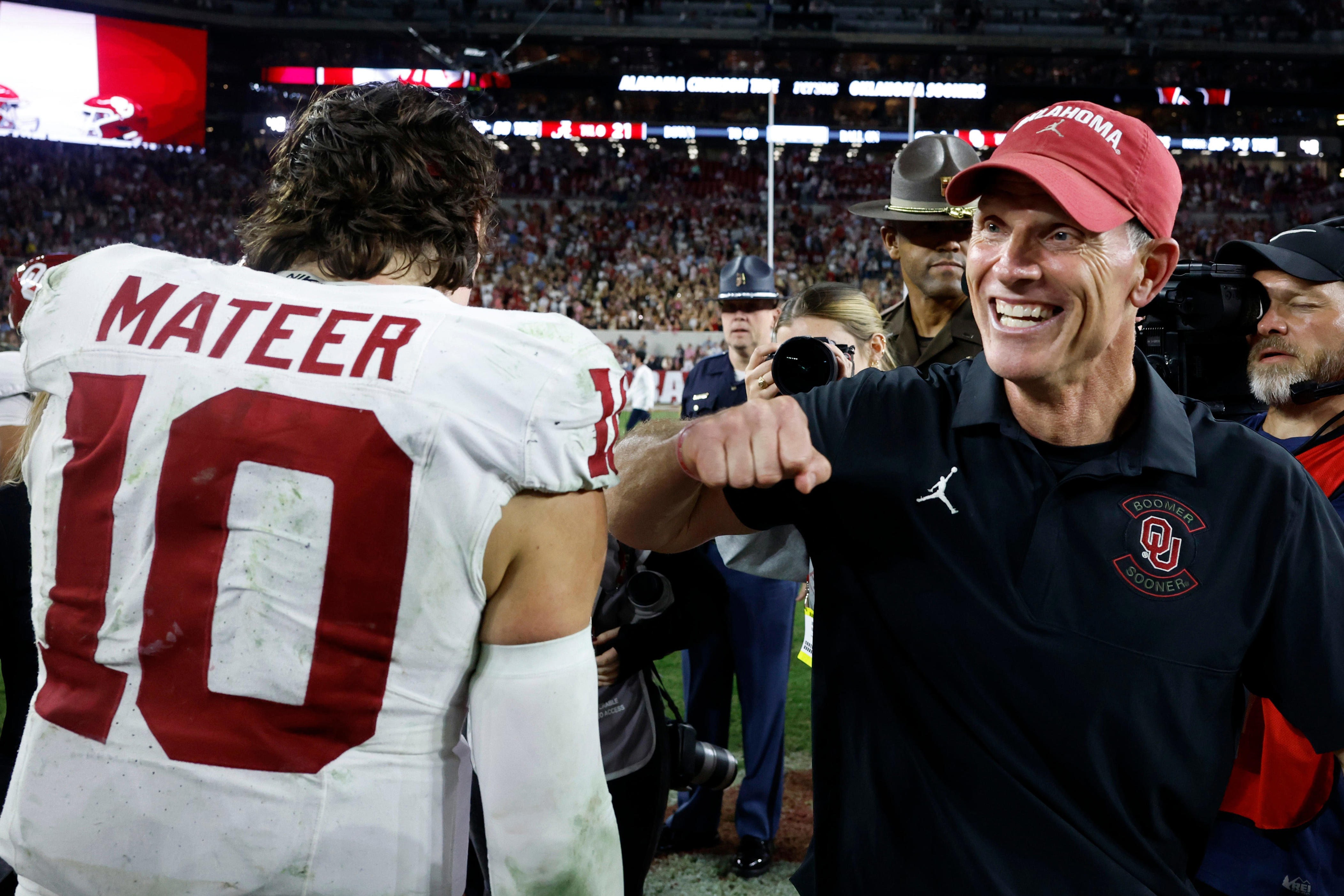 TUSCALOOSA, ALABAMA - NOVEMBER 15: John Mateer #10 of the Oklahoma Sooners celebrates with Brent Venables of the Oklahoma Sooners after a win over the Alabama Crimson Tide in a football game at Bryant Denny Stadium on November 15, 2025 in Tuscaloosa, Alabama. (Photo by Butch Dill/Getty Images)