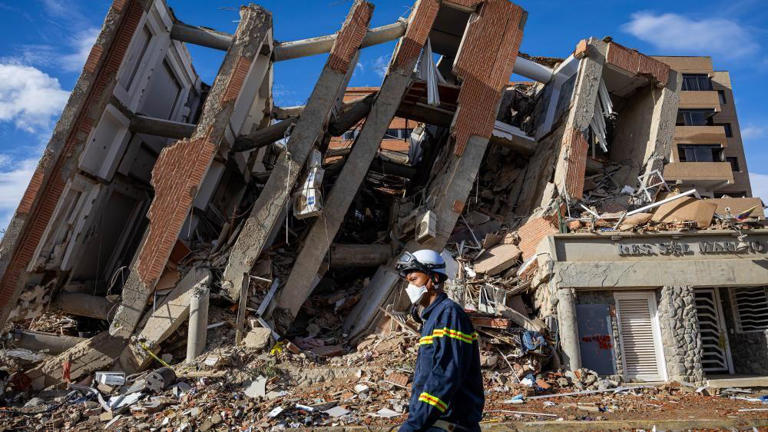 The quakes damaged or destroyed 58,870 buildings, NASA said.