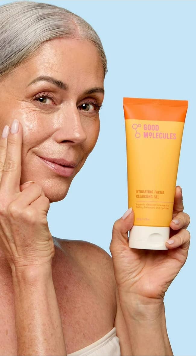model applying cleanser with text highlighting product features: non-stripping, gentle, suitable for all skin types, cruelty-free, vegan, fragrance-free