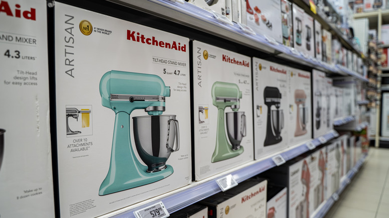 What does KitchenAid do with unsold or returned mixers?