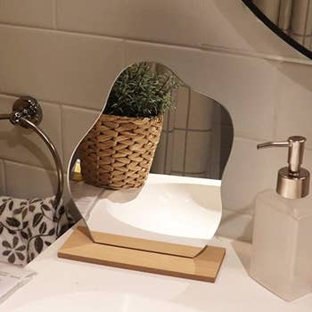 the cloud mirror with wood base