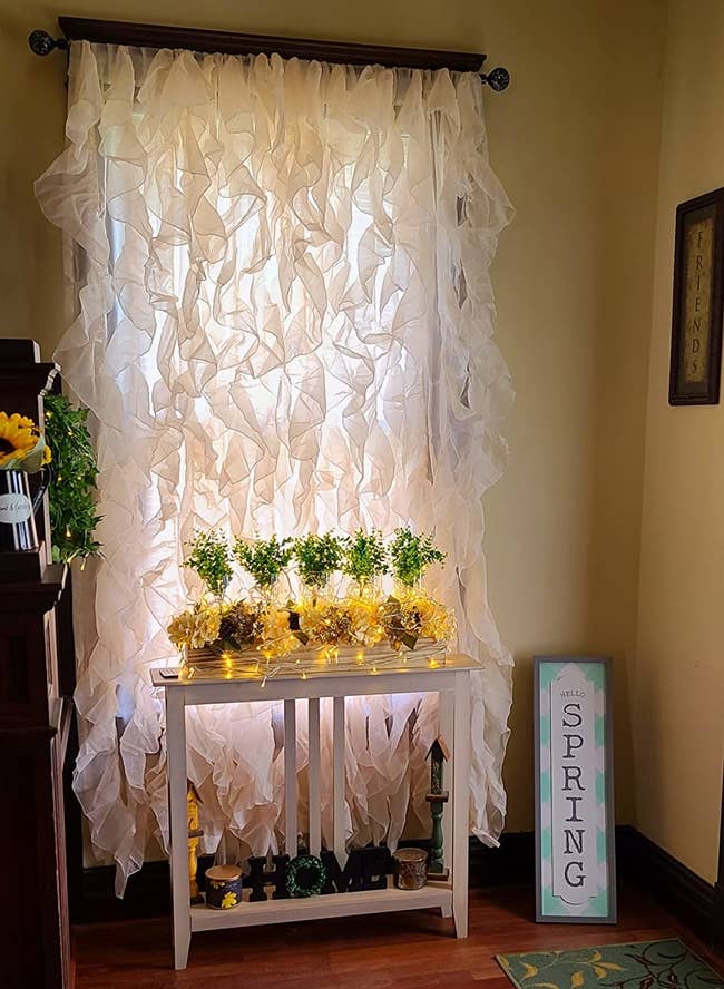 sheer ruffled curtains hanging from a reviewer's window