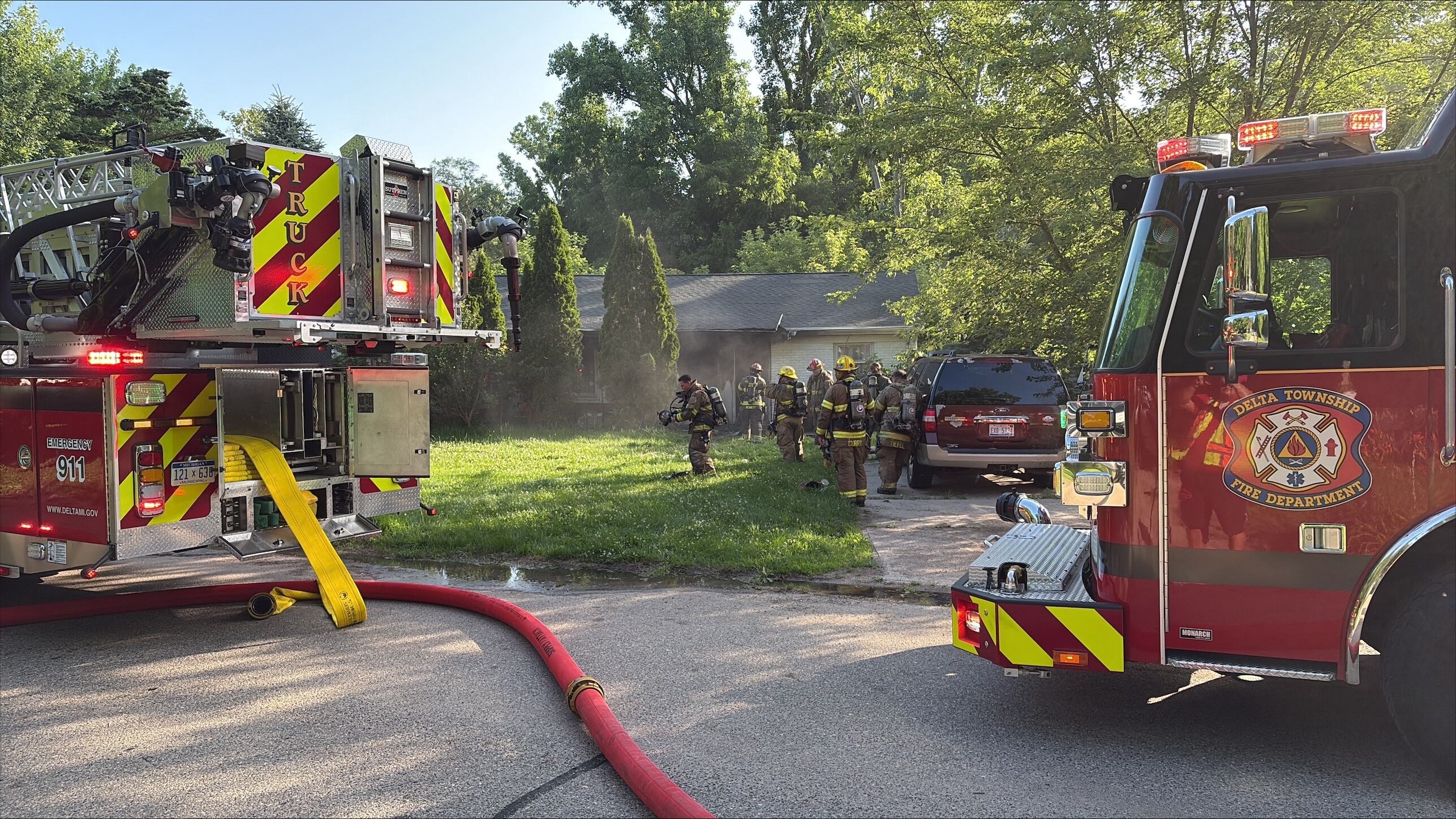 Crews battle house fire in Lansing Wednesday morning