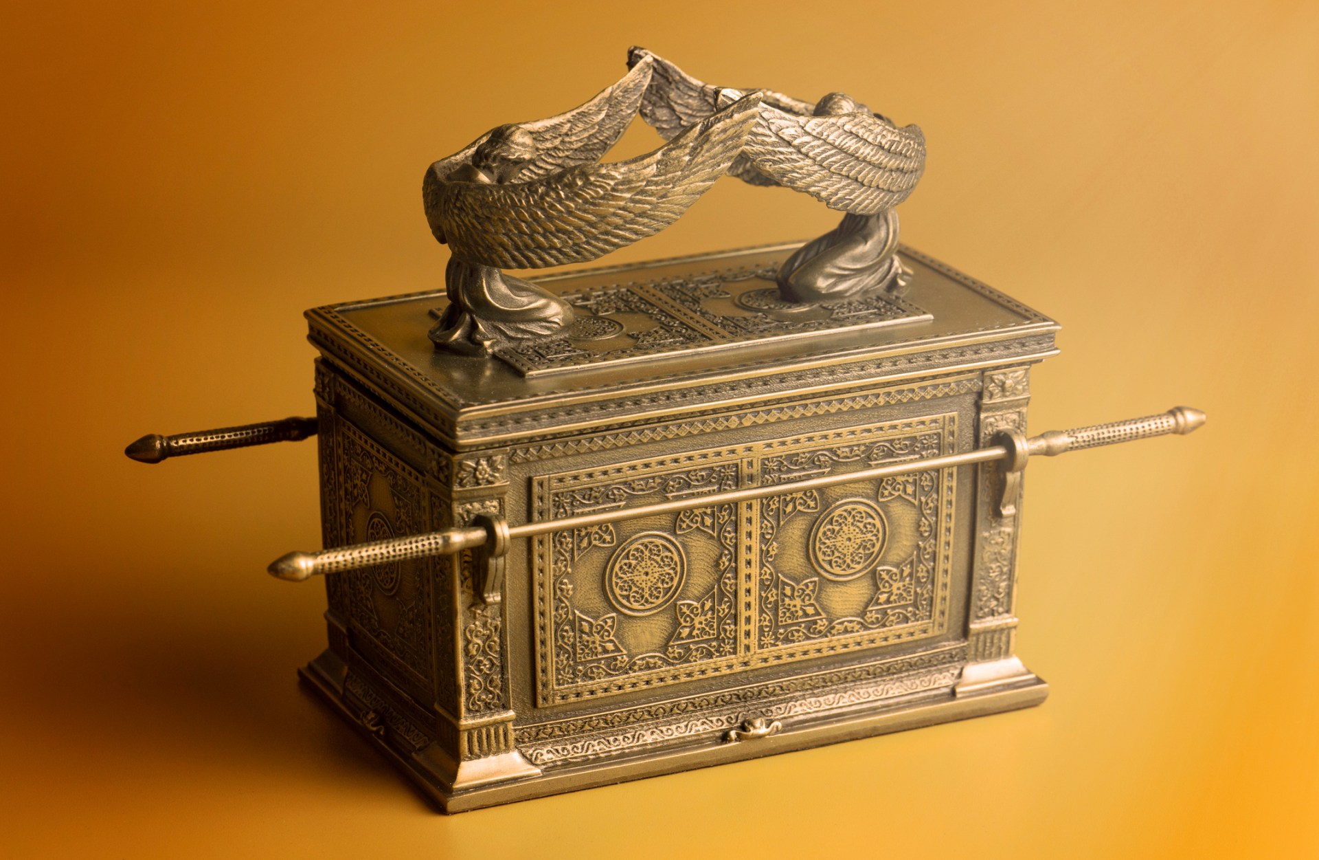 The Ark of the Covenant on a gold background.