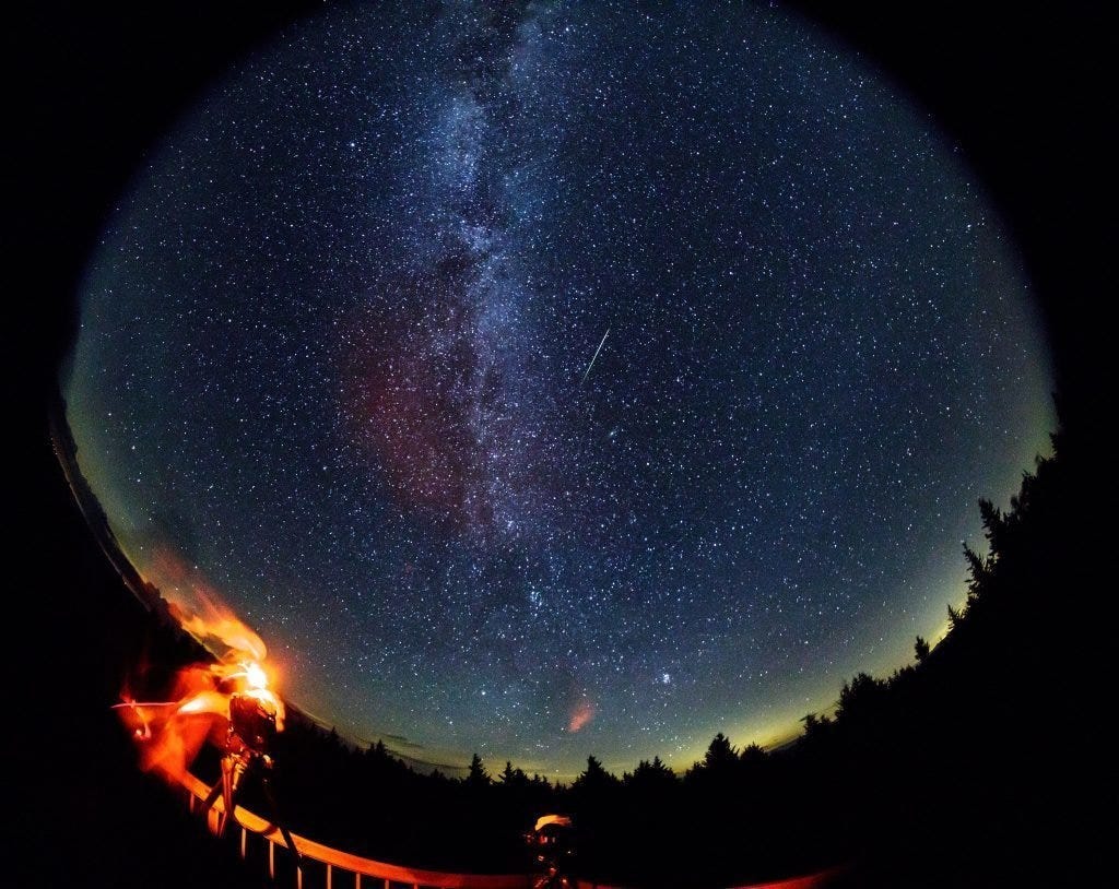 A meteor streaks across the sky during the annual Perseid meteor shower on Friday, Aug. 12, 2016 in Spruce Knob, West Virginia.