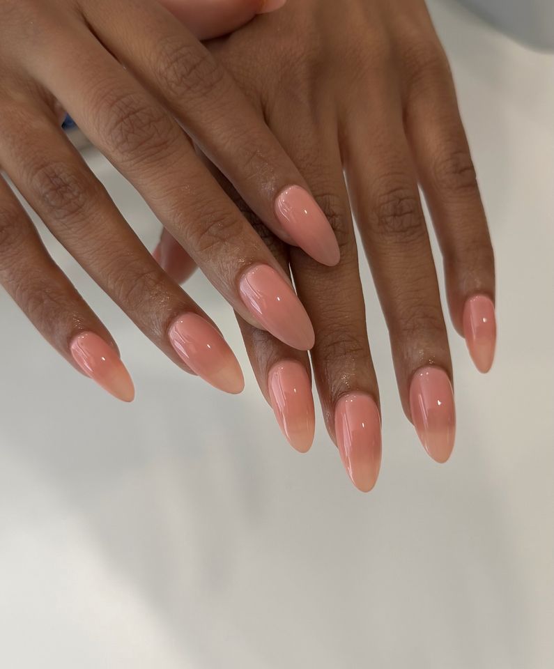 Wellmanicured hands showcasing almondshaped nails