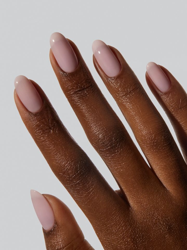 A hand with manicured nails in a natural style