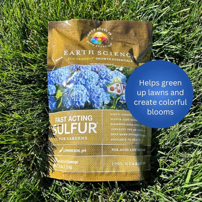A bag of Earth Science fast-acting sulfur on grass, with text highlighting its benefits for greening lawns and enhancing colorful blooms