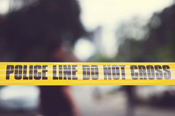 A blurred image featuring a yellow tape with the words 