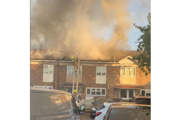 Watch: Residents forced to flee homes after roofs ignited in major ...