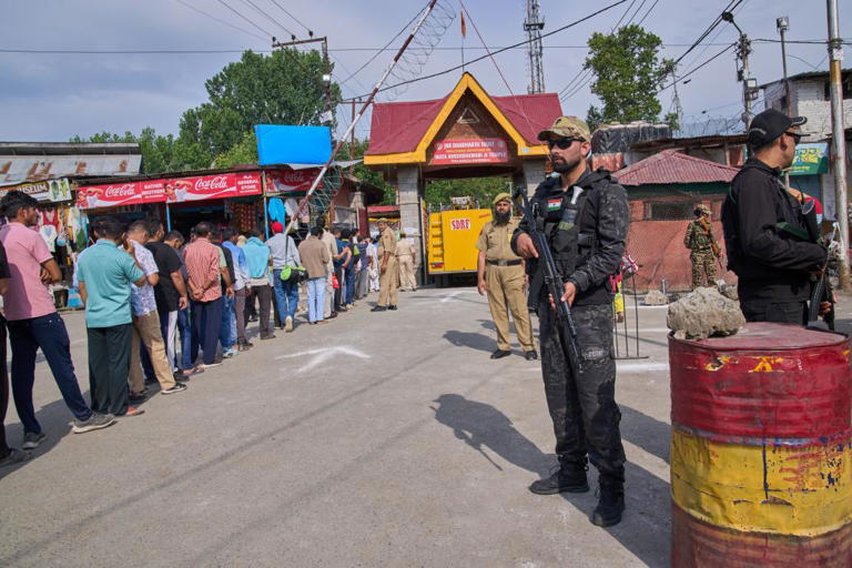 Indian security forces stand guard during the annual festival dedicated to the Hindu goddess Durga