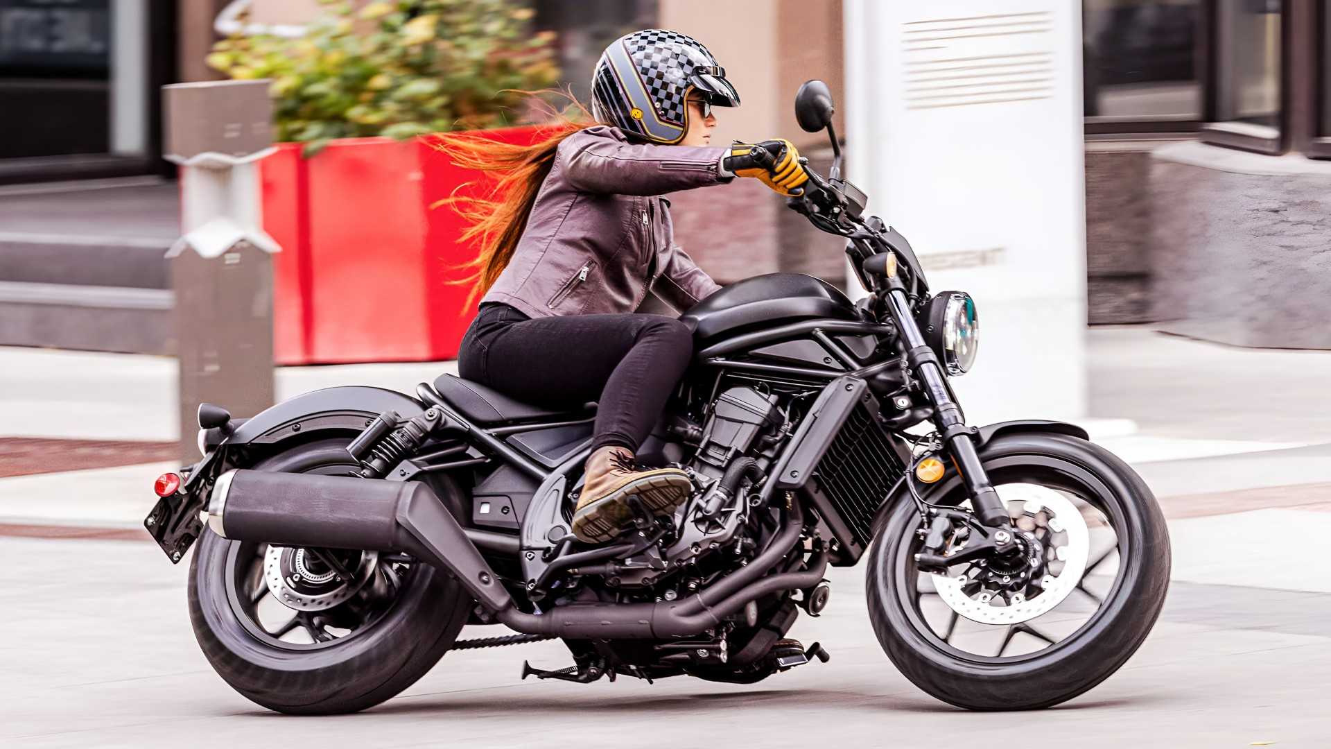 2026 Honda Rebel 1100 cornering comfortably along an urban road