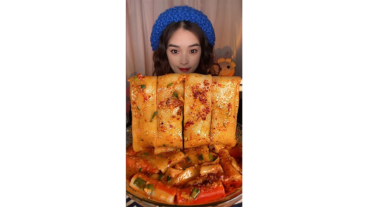 Eating giant spicy rice cake rolls mukbang with chili oil feast