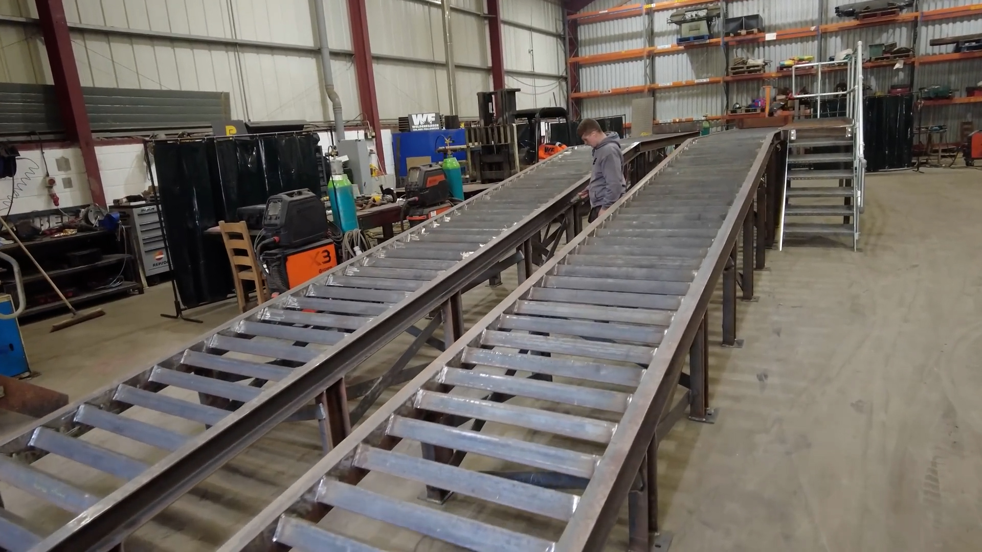 Custom steel access ramp and staircase fabricated for industrial facility