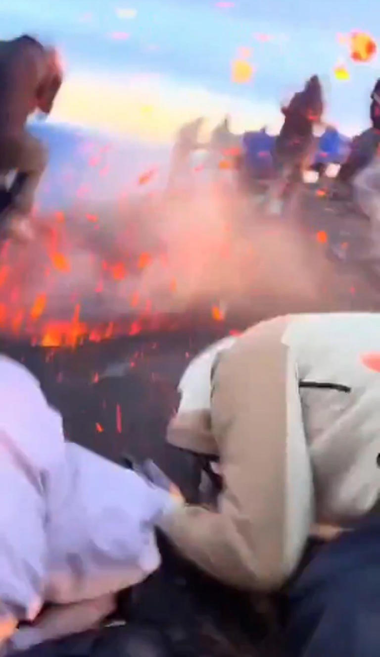 Terrified tourists scramble for cover as they’re pelted with lava ...