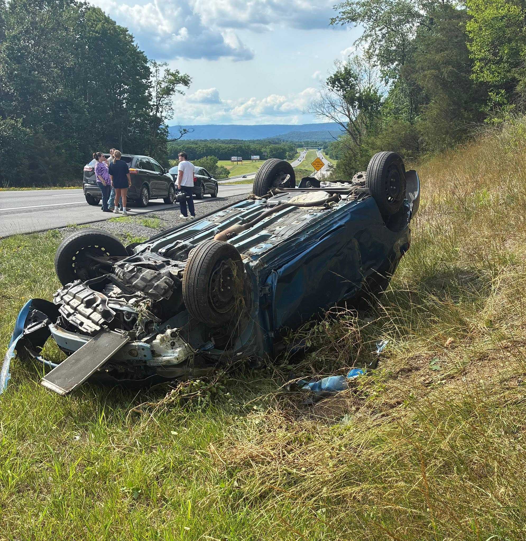 1 hospitalized after car flips onto roof off Route 322