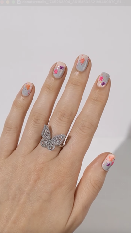 Short nails with little butterfly designs