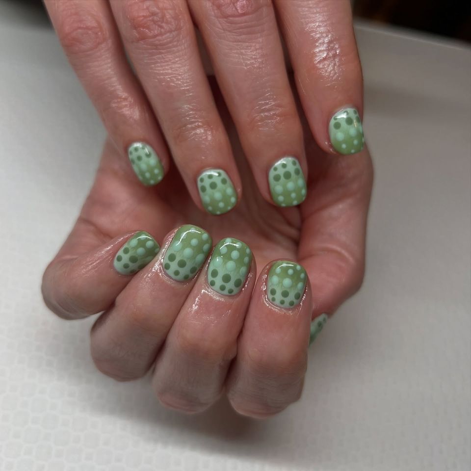 Green ombre nails with ombre dots